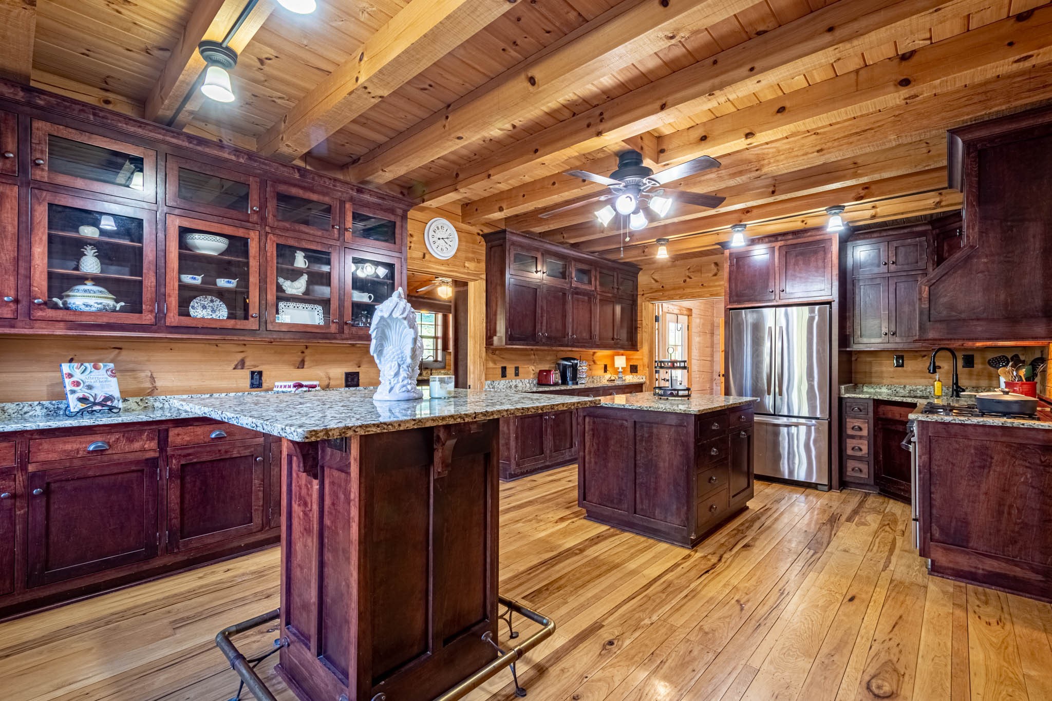 860 Loyd Road Pulaski, TN 38478 - Photo 19 of 70 a kitchen with wooden floors and wooden cabinets