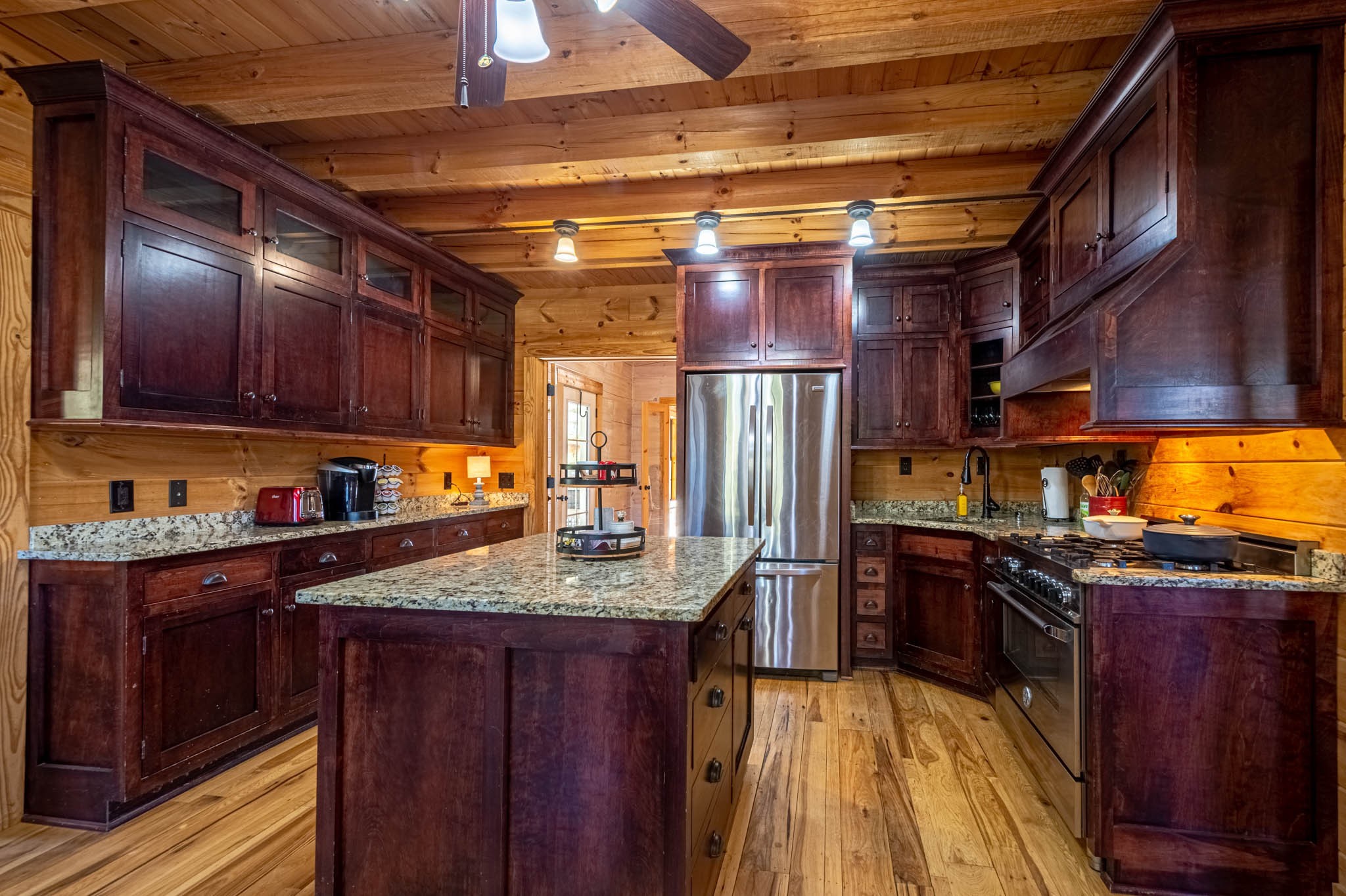 860 Loyd Road Pulaski, TN 38478 - Photo 20 of 70 a kitchen with stainless steel appliances granite countertop a sink a stove and cabinets