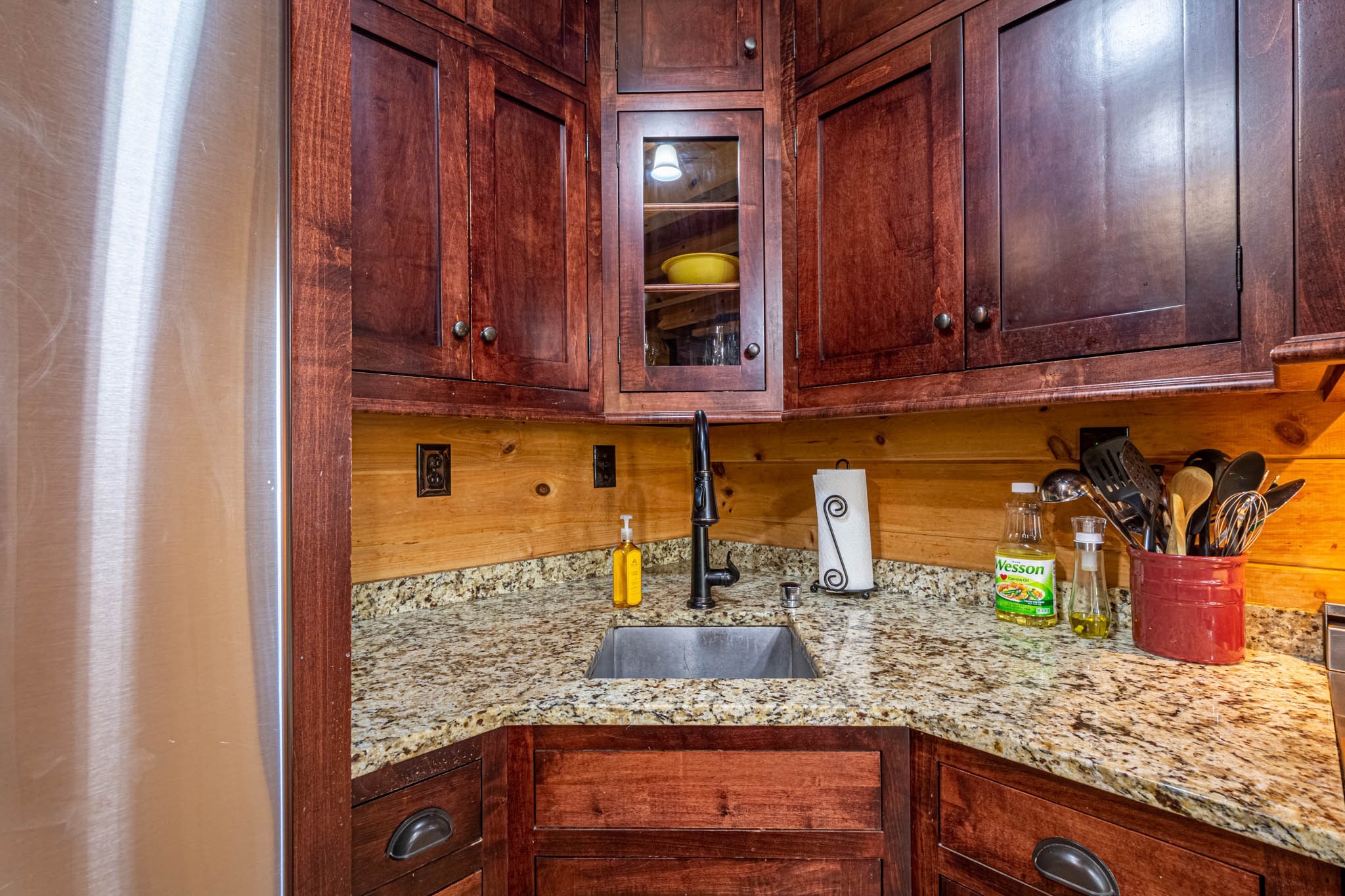 860 Loyd Road Pulaski, TN 38478 - Photo 22 of 70 a kitchen with wooden cabinets and a sink