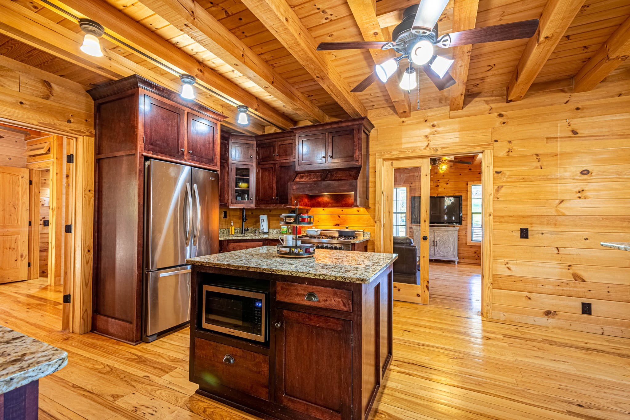 860 Loyd Road Pulaski, TN 38478 - Photo 23 of 70 a kitchen with stainless steel appliances granite countertop a stove and a refrigerator