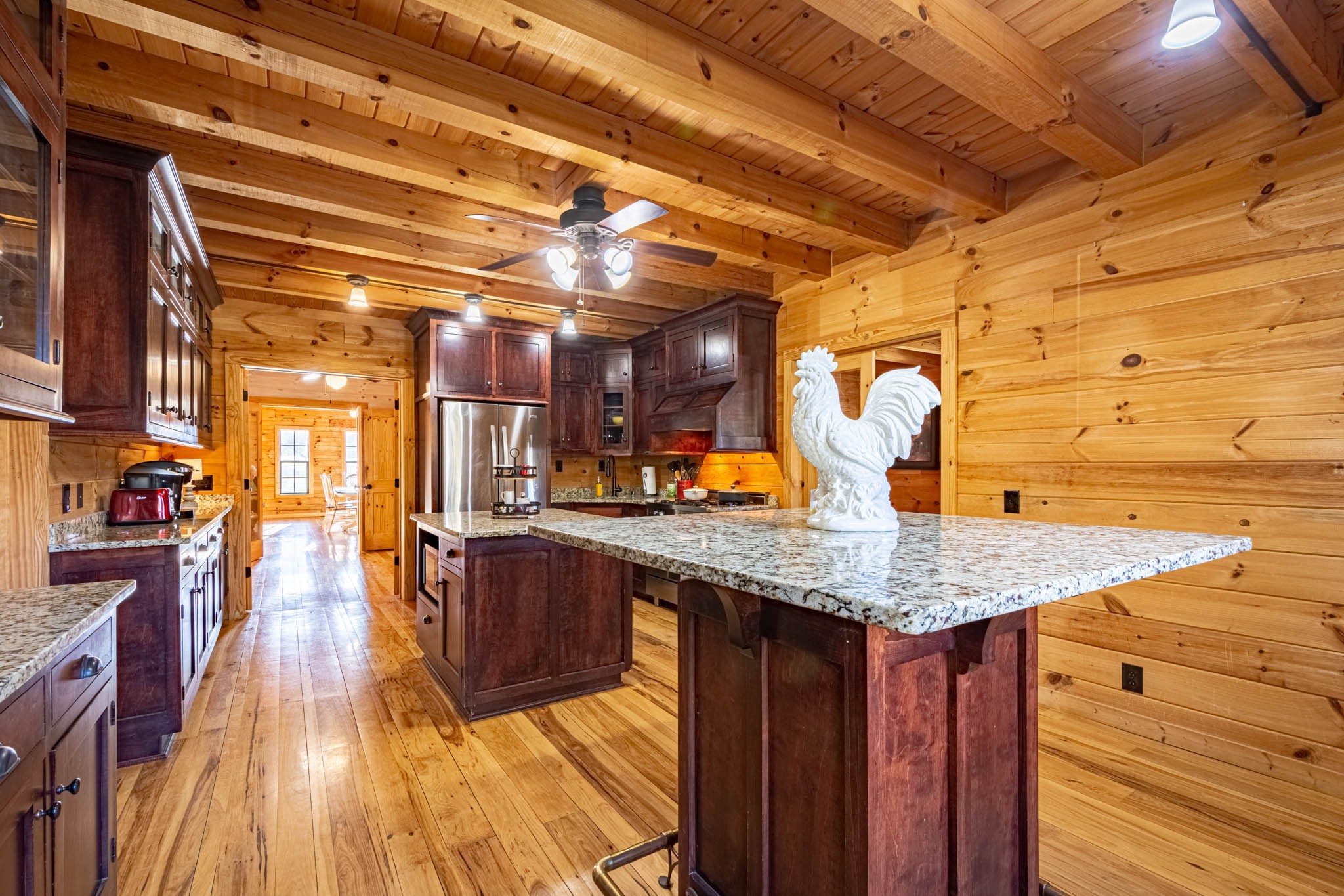 860 Loyd Road Pulaski, TN 38478 - Photo 25 of 70 a kitchen with stainless steel appliances granite countertop a sink and wooden cabinets