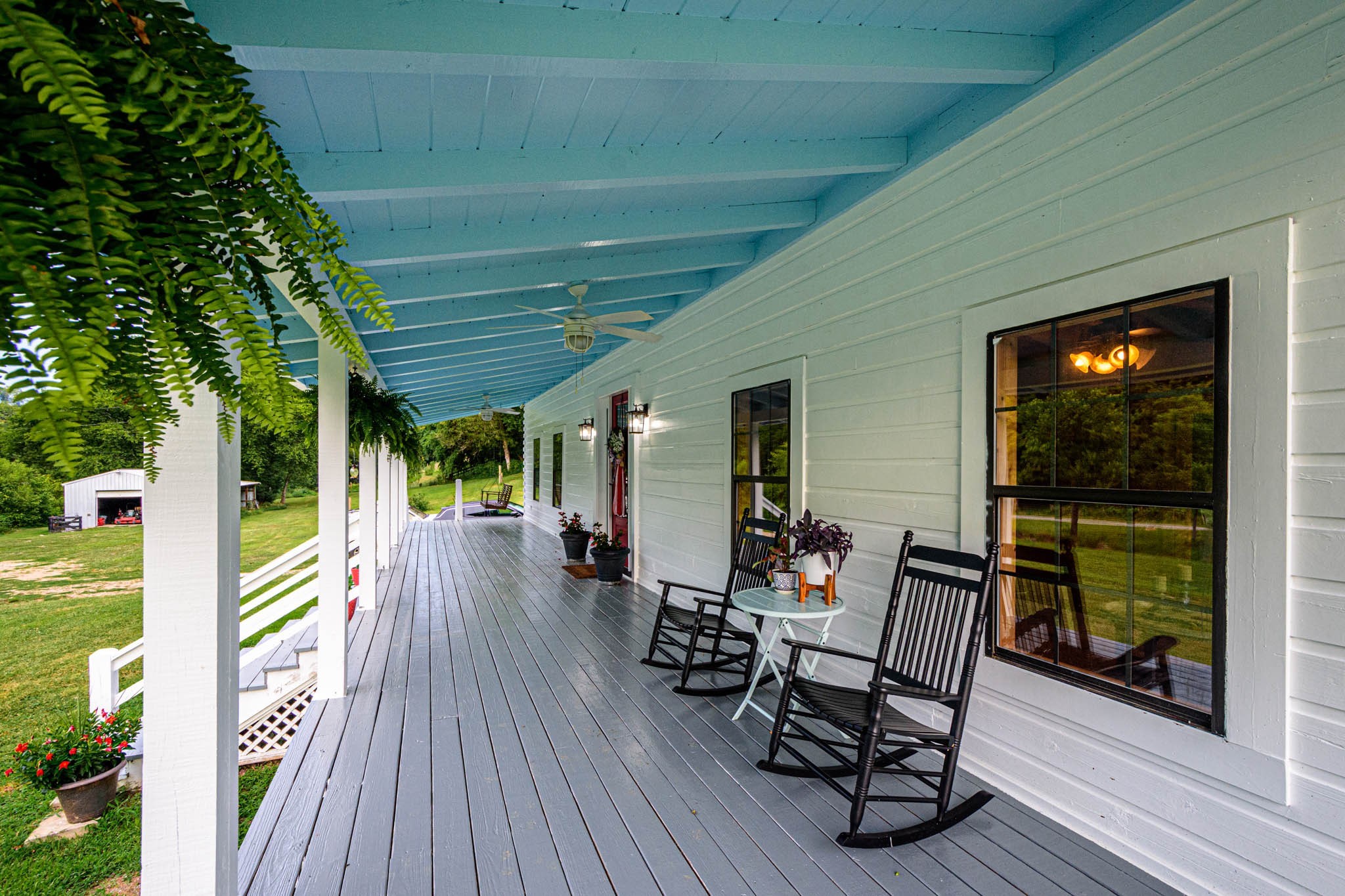 860 Loyd Road Pulaski, TN 38478 - Photo 41 of 70 a view of a patio with a table chairs and a backyard