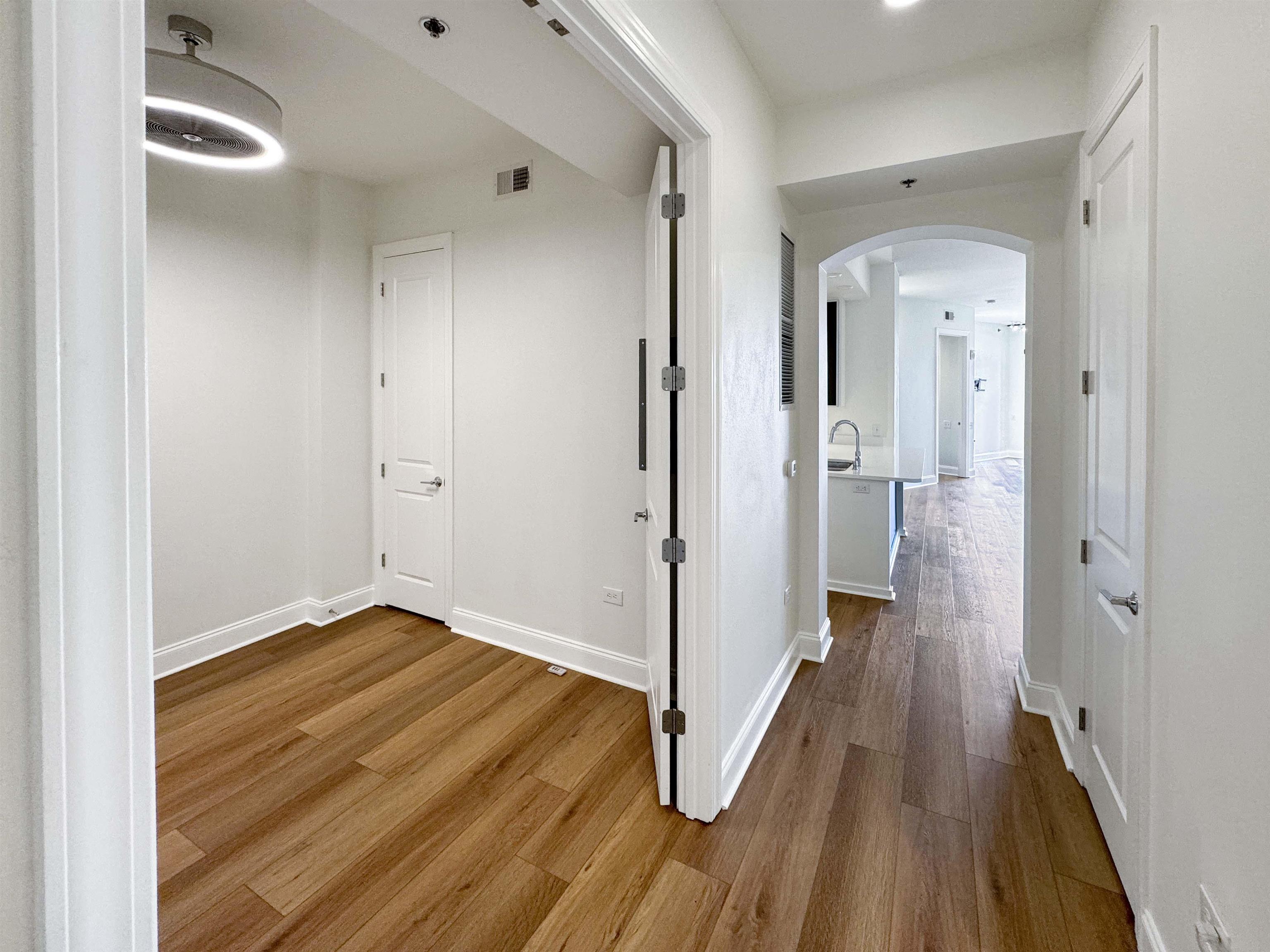 717 Riverside Drive, Unit 707 Memphis, TN 38103 - Photo 16 of 39 Corridor featuring wood-type flooring