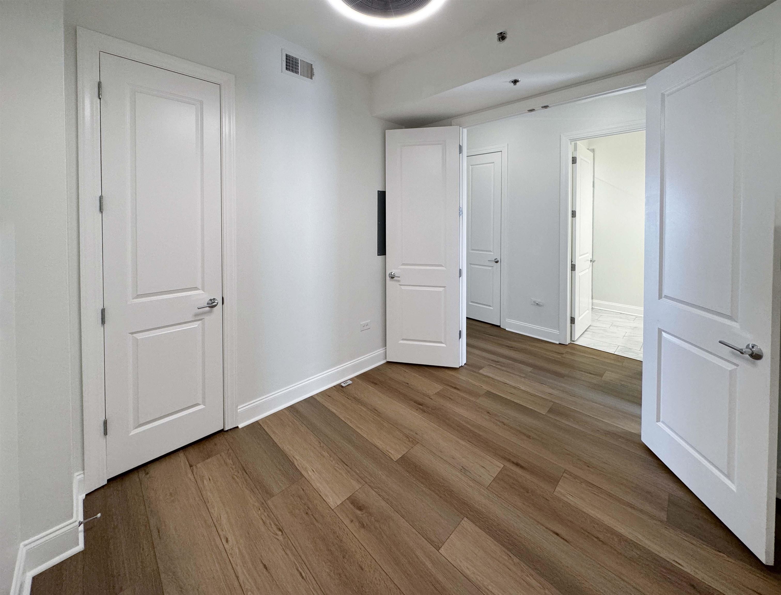 717 Riverside Drive, Unit 707 Memphis, TN 38103 - Photo 17 of 39 Unfurnished office or bedroom featuring dark wood-type flooring