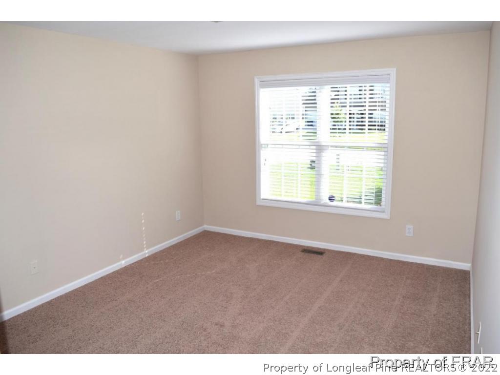 192 Lennox Loop Raeford, NC 28376 - Photo 21 of 33 an empty room with a window