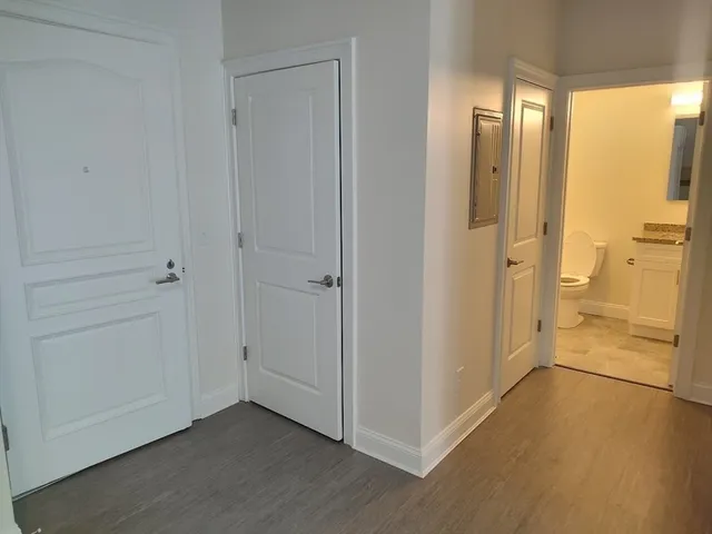 a view of an empty room and closet area