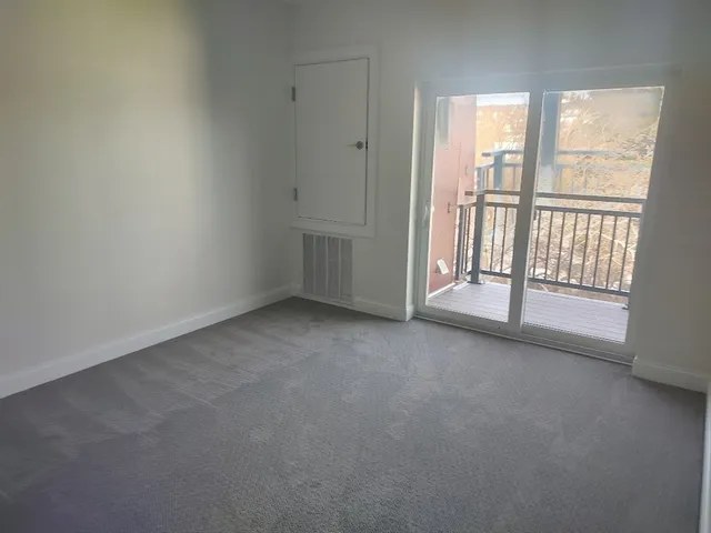 a white toilet sitting next to a bath tub