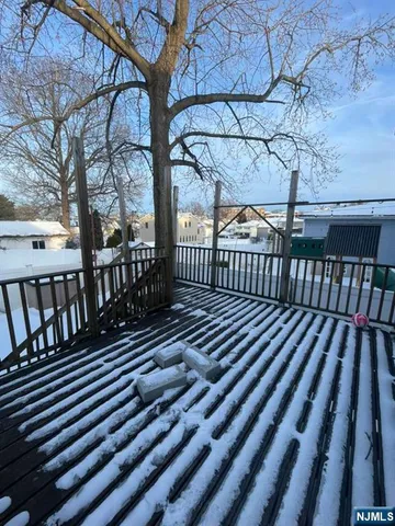 a view of balcony with wooden floor