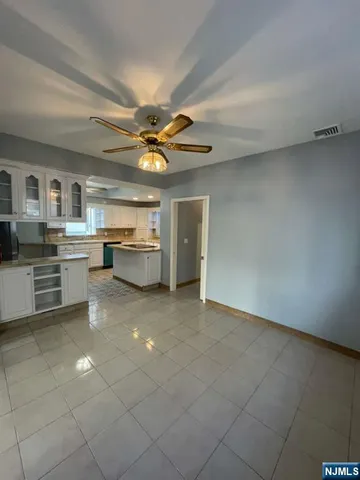 a kitchen with a cabinets and window