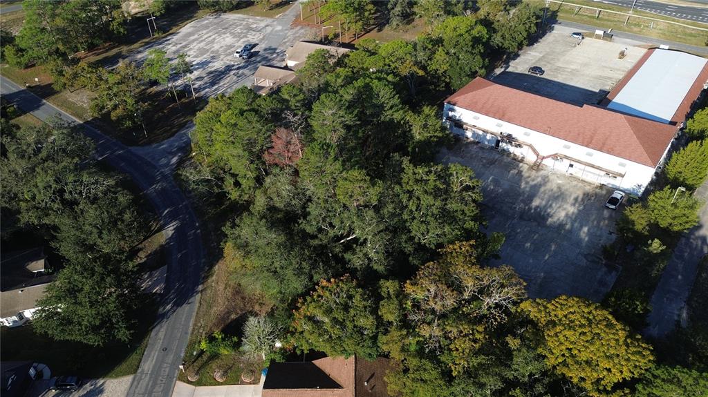 7939 Rhanbuoy Road Spring Hill, FL 34606 - Photo 7 of 10 an aerial view of a house with a yard
