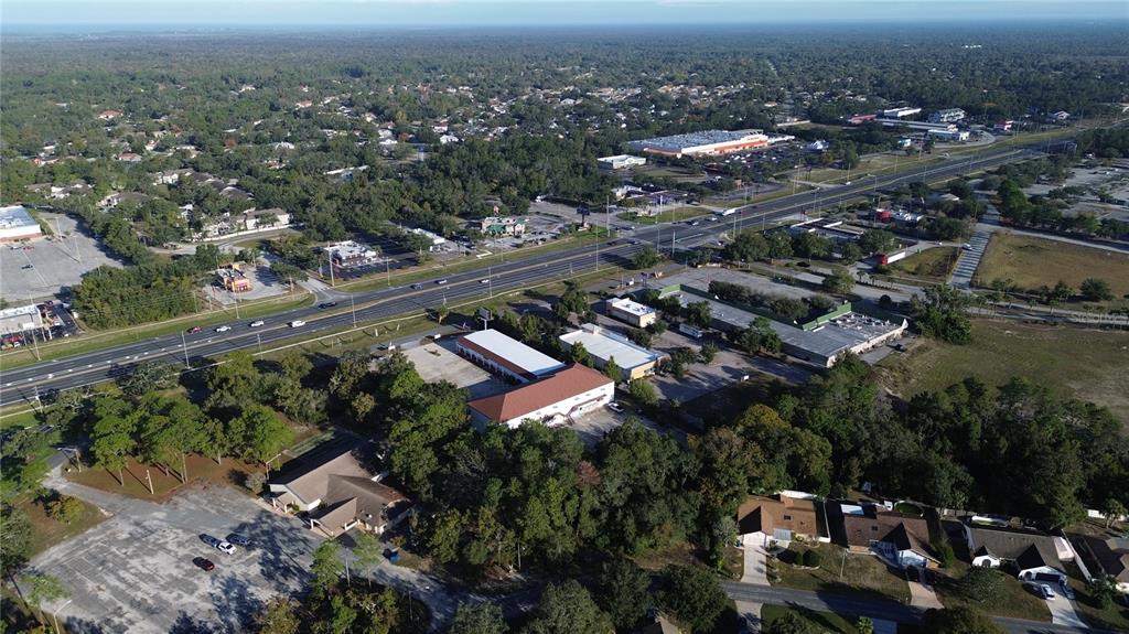 7939 Rhanbuoy Road Spring Hill, FL 34606 - Photo 8 of 10 an aerial view of a city with lots of residential buildings