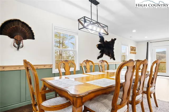 a dining room with furniture and window