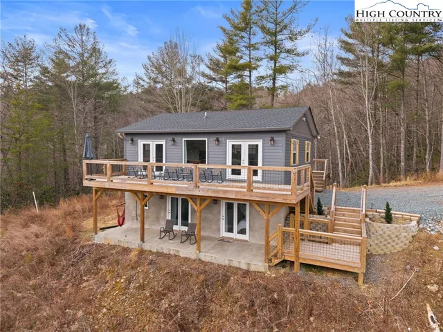 a view of a city with lush green forest