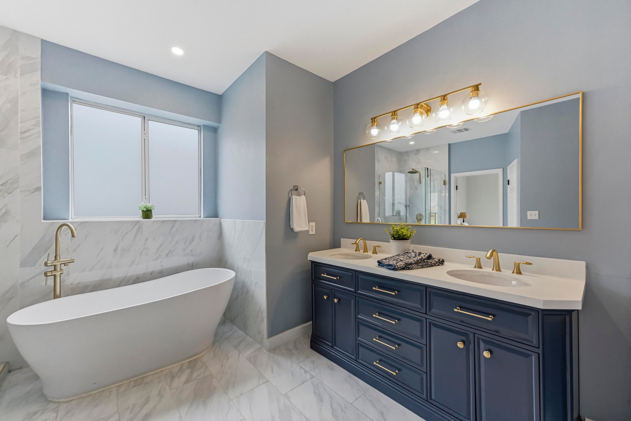 11200 Savin Hill Lane Austin, TX 78739 - Photo 13 of 32 a bathroom with a double vanity sink and a mirror