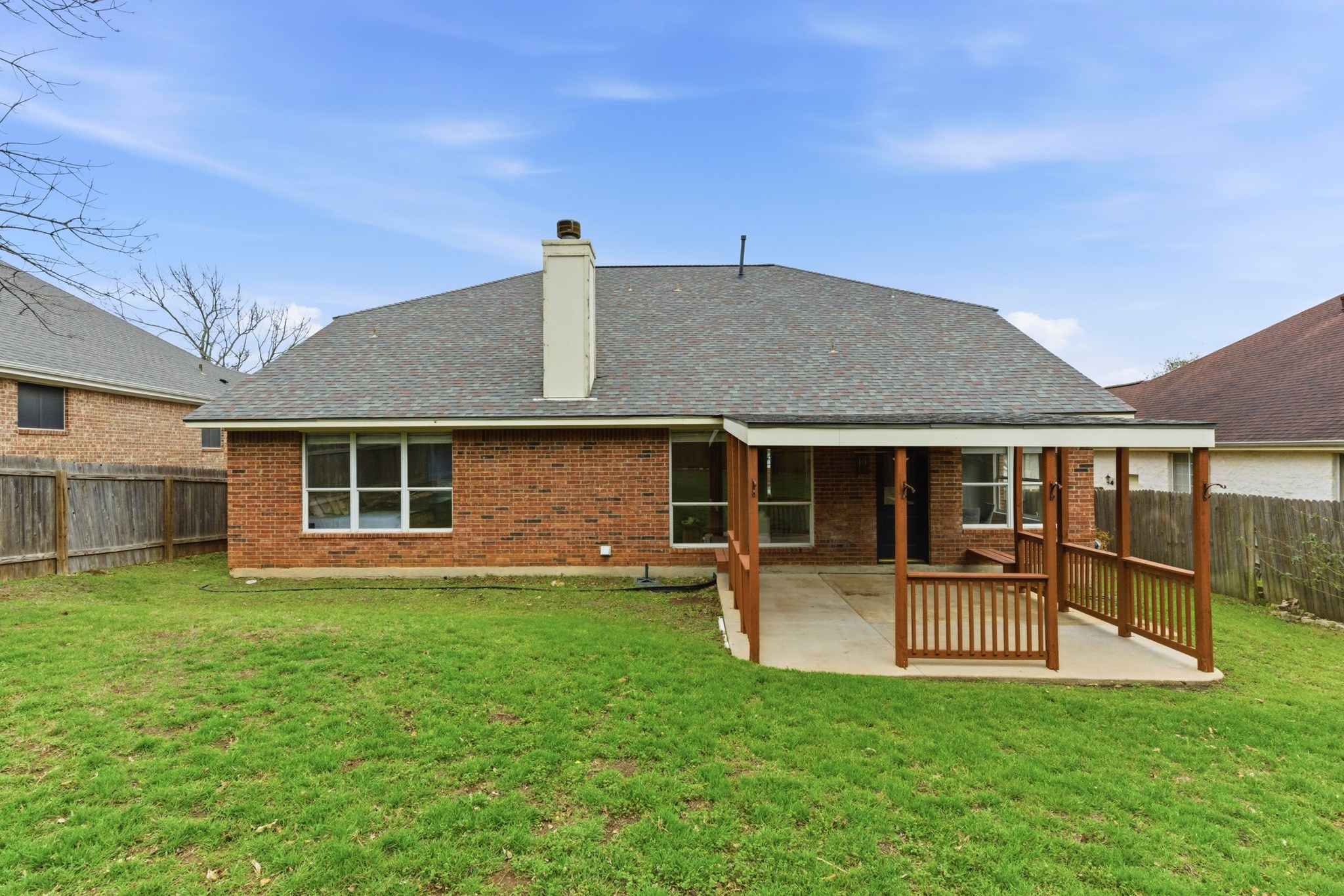 11200 Savin Hill Lane Austin, TX 78739 - Photo 24 of 32 front view of a house with a yard