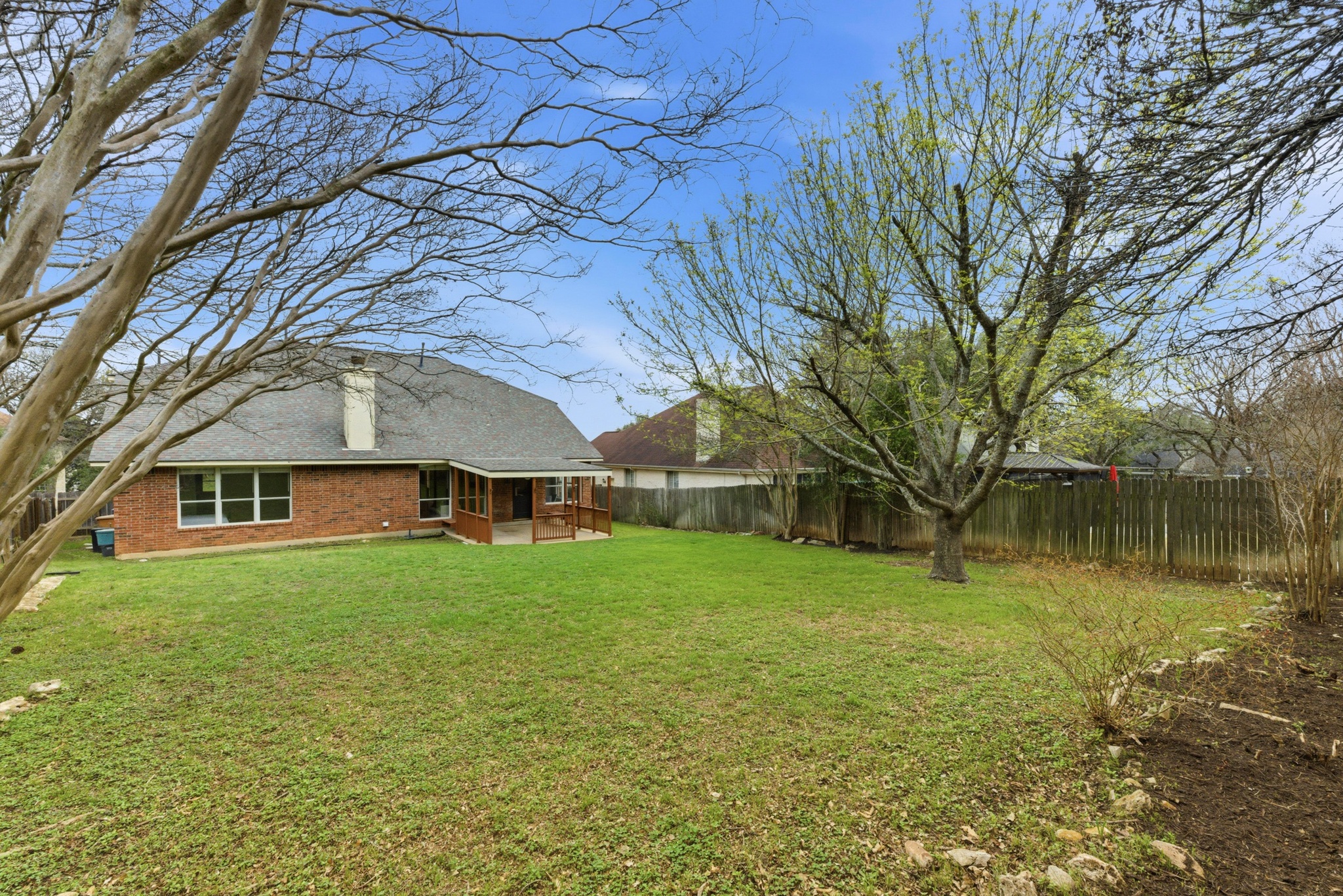 11200 Savin Hill Lane Austin, TX 78739 - Photo 25 of 32 a house view with a garden space