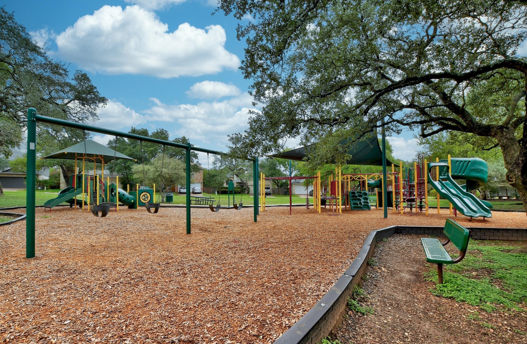 11200 Savin Hill Lane Austin, TX 78739 - Photo 28 of 32 a view of a park with swings
