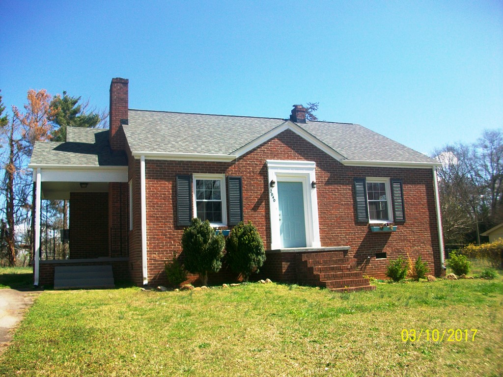 This charming brick home features a classic exterior and inviting curb appeal.