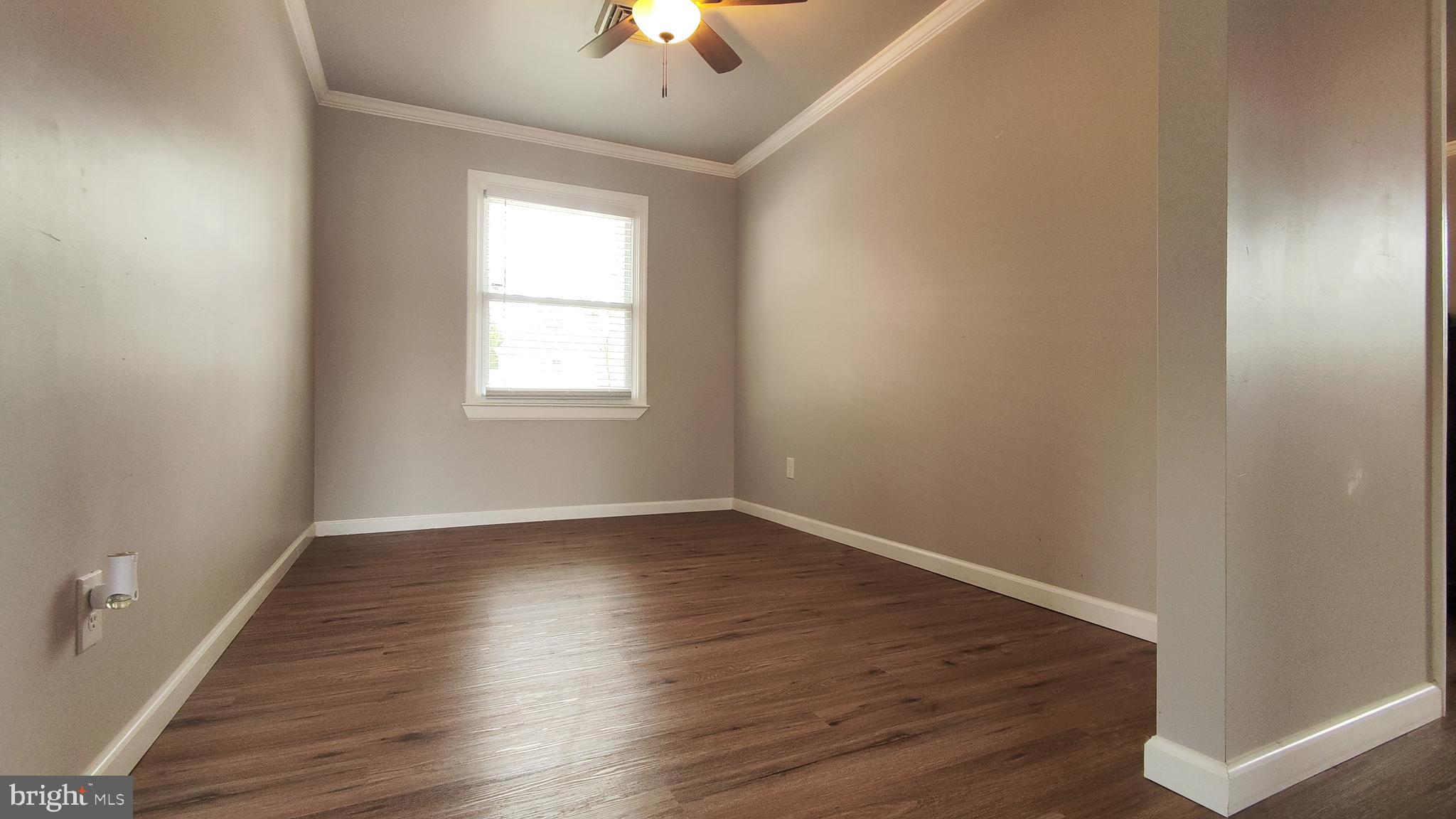 1706 Spencer Drive Croydon, PA 19021 - Photo 3 of 15 an empty room with wooden floor and windows