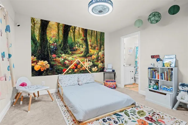 a living room with furniture kitchen view and a potted plant