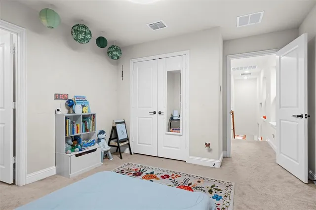a living room with a book shelf and a couch