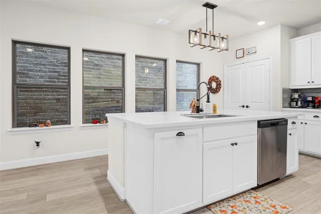 a very nice looking room with a large window and chandelier