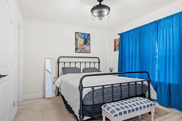 a view of hallway with stairs and wooden floor