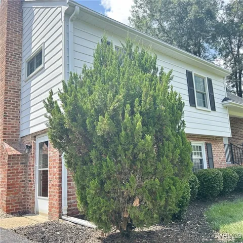 a view of a house with a tree