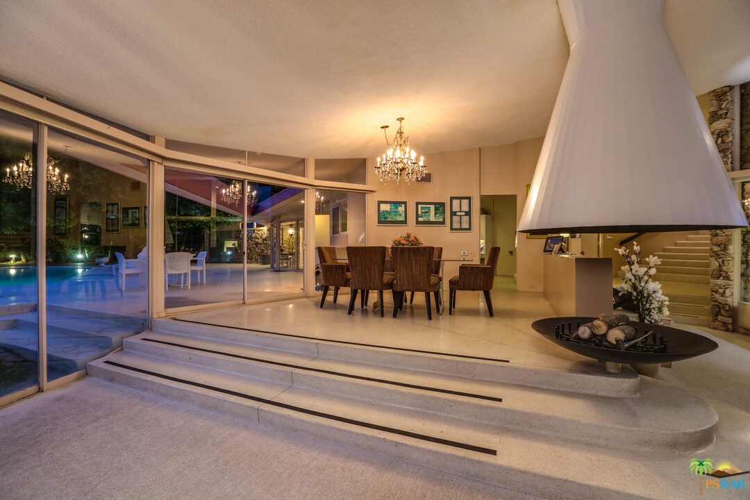1350 Ladera Circle Palm Springs, CA 92262 - Photo 23 of 50 a view of a dining room with furniture and chandelier