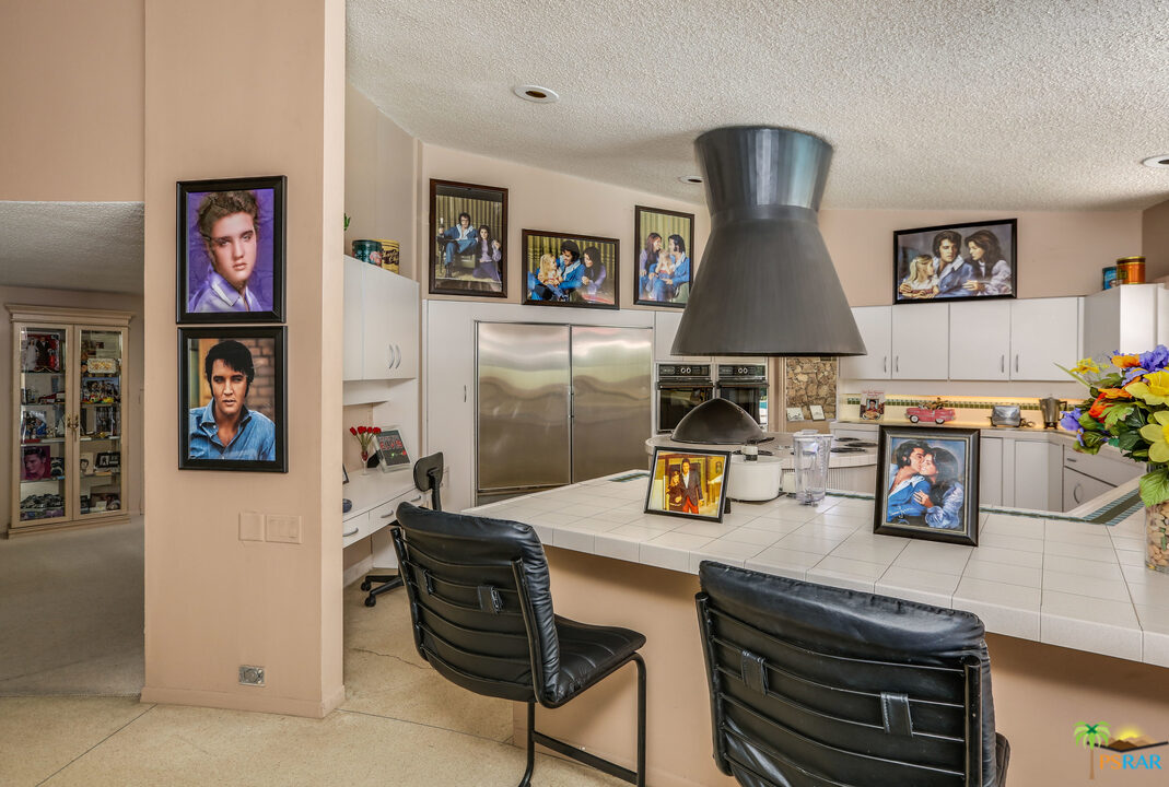 1350 Ladera Circle Palm Springs, CA 92262 - Photo 26 of 50 a living room with furniture and a flat screen tv