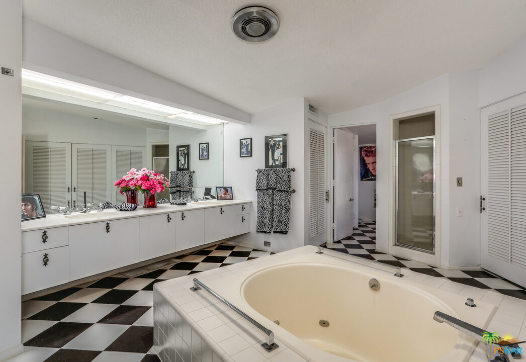 1350 Ladera Circle Palm Springs, CA 92262 - Photo 40 of 50 a bathroom with a tub sink mirror and vanity