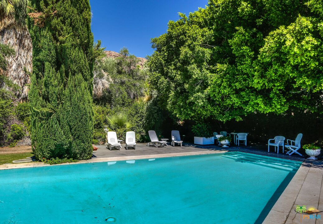 1350 Ladera Circle Palm Springs, CA 92262 - Photo 44 of 50 a table and chairs sitting in the garden