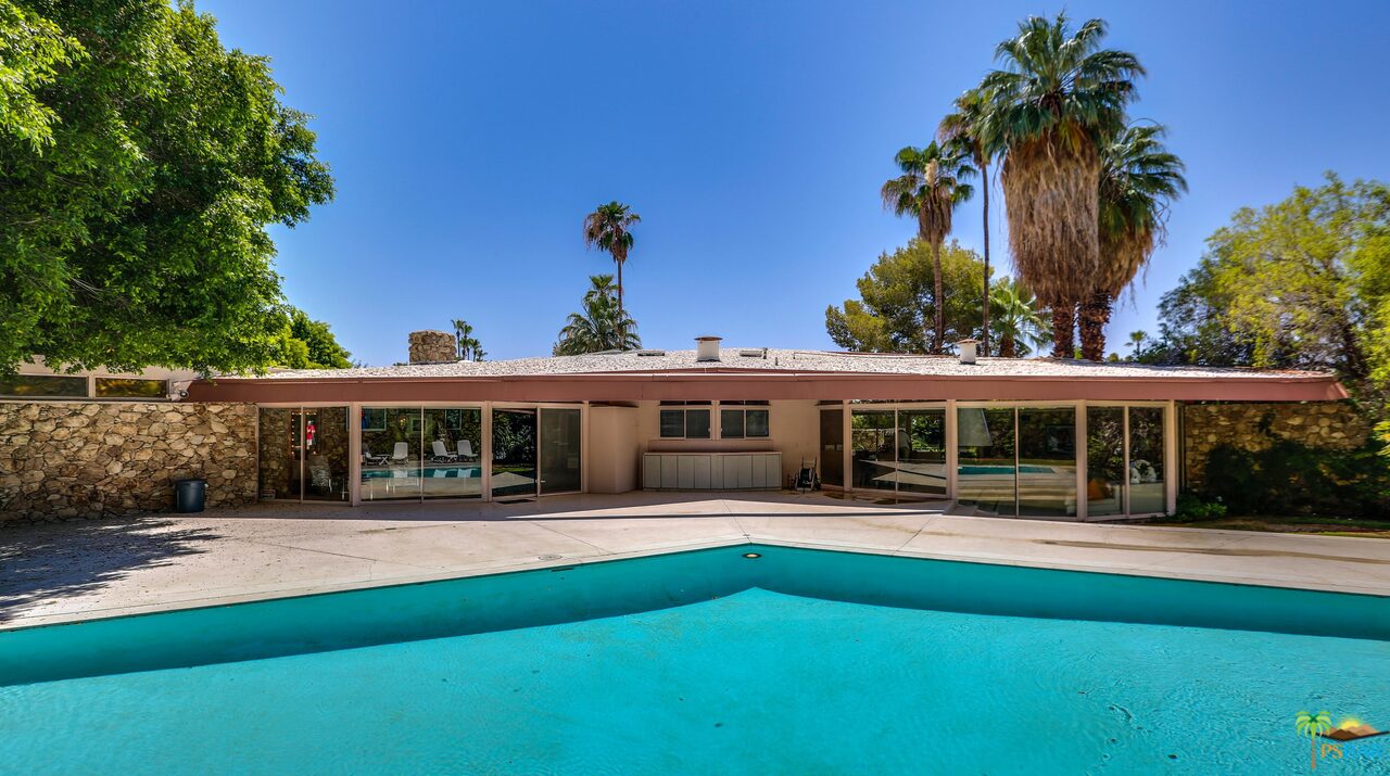 1350 Ladera Circle Palm Springs, CA 92262 - Photo 47 of 50 a front view of a house with a yard table and chairs