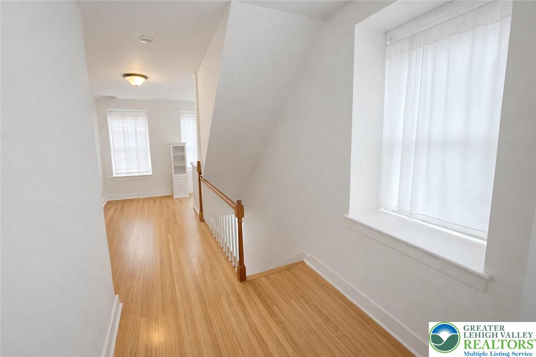 10637 Schantz Road Breinigsville, PA 18031 - Photo 11 of 19 a view of hallway with wooden floor