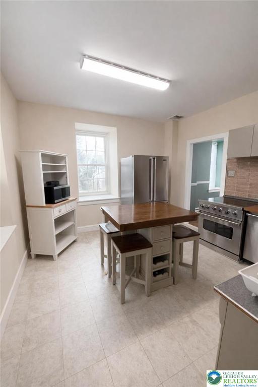 10637 Schantz Road Breinigsville, PA 18031 - Photo 3 of 19 a room with furniture a table and chairs