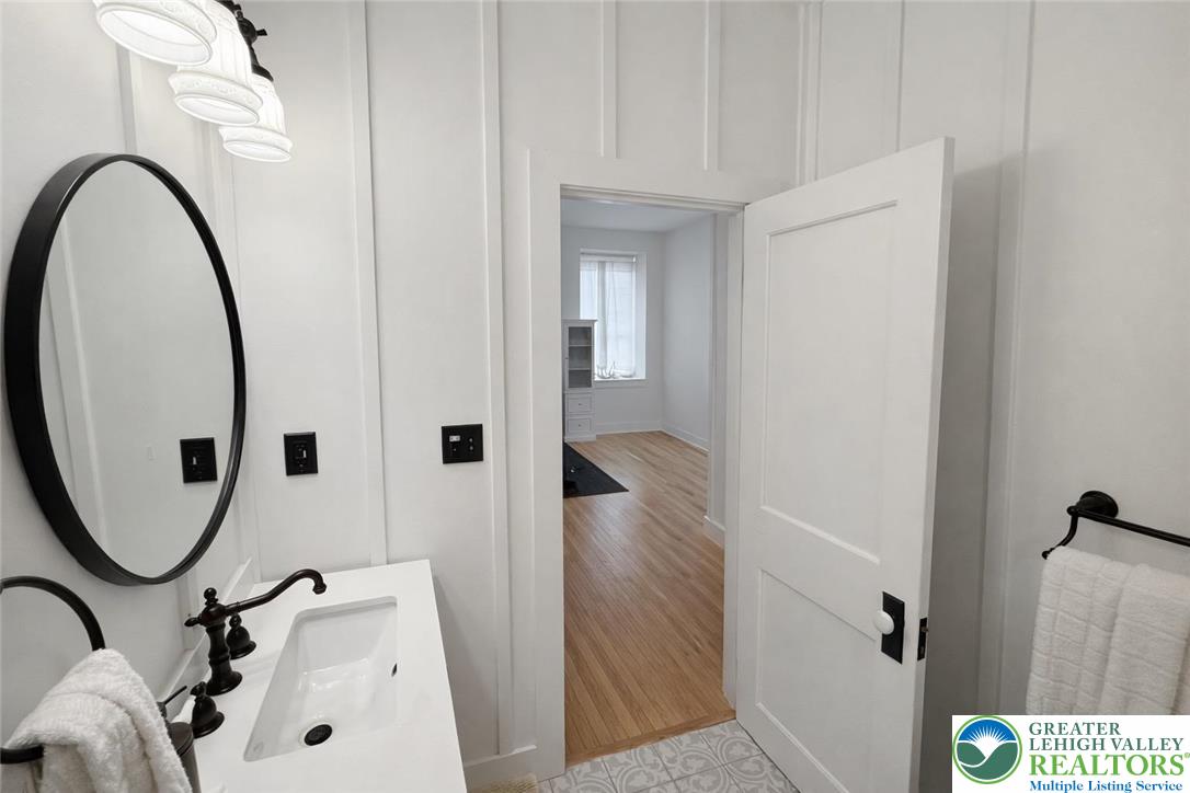 10637 Schantz Road Breinigsville, PA 18031 - Photo 10 of 19 a bathroom with a sink and a mirror