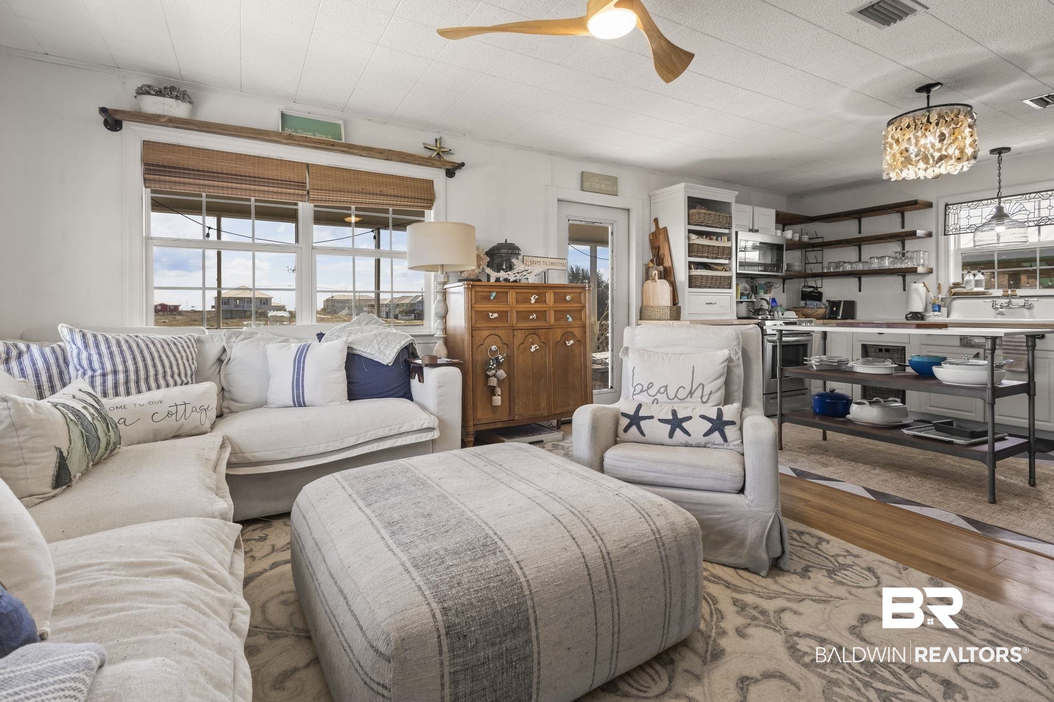 2514 Muscogee Road Gulf Shores, AL 36542 - Photo 10 of 60 Living room with light hardwood / wood-style floors and ceiling fan with notable chandelier