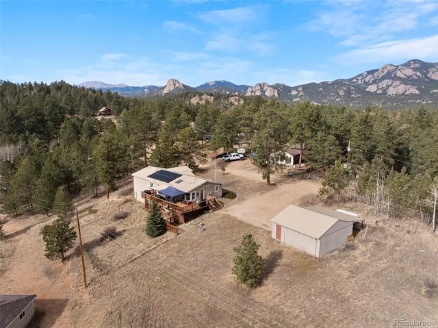 an aerial view of a garden with mountain view