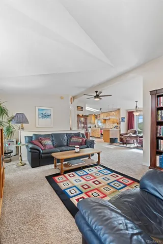 a kitchen that has a lot of cabinets in it and wooden floors