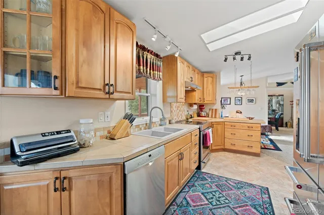 a living room with furniture a window and a chandelier