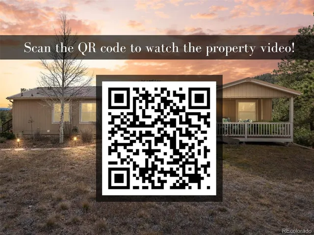 an aerial view of a house with yard swimming pool and mountain view in back