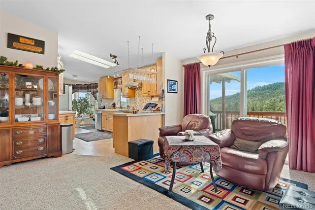a bathroom with a tub a sink and a window