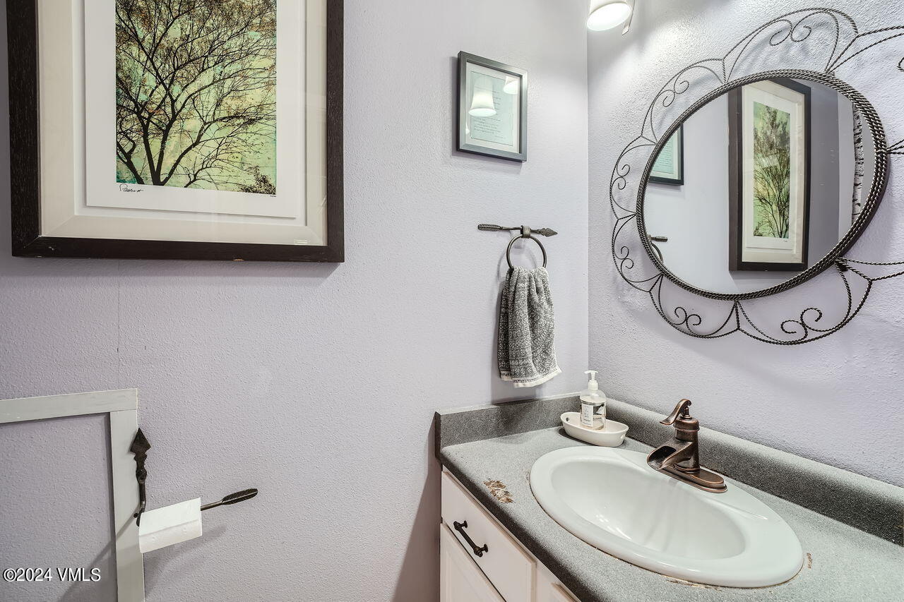 316 Golden Eagle Eagle, CO 81631 - Photo 13 of 25 a bathroom with a sink and a mirror