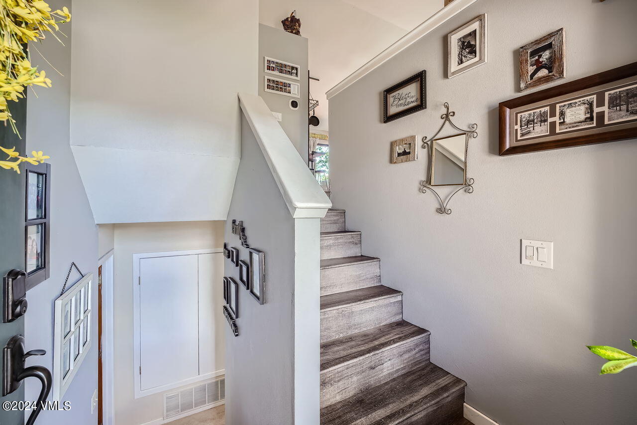 316 Golden Eagle Eagle, CO 81631 - Photo 14 of 25 a view of staircase with lots of frames on wall and a window