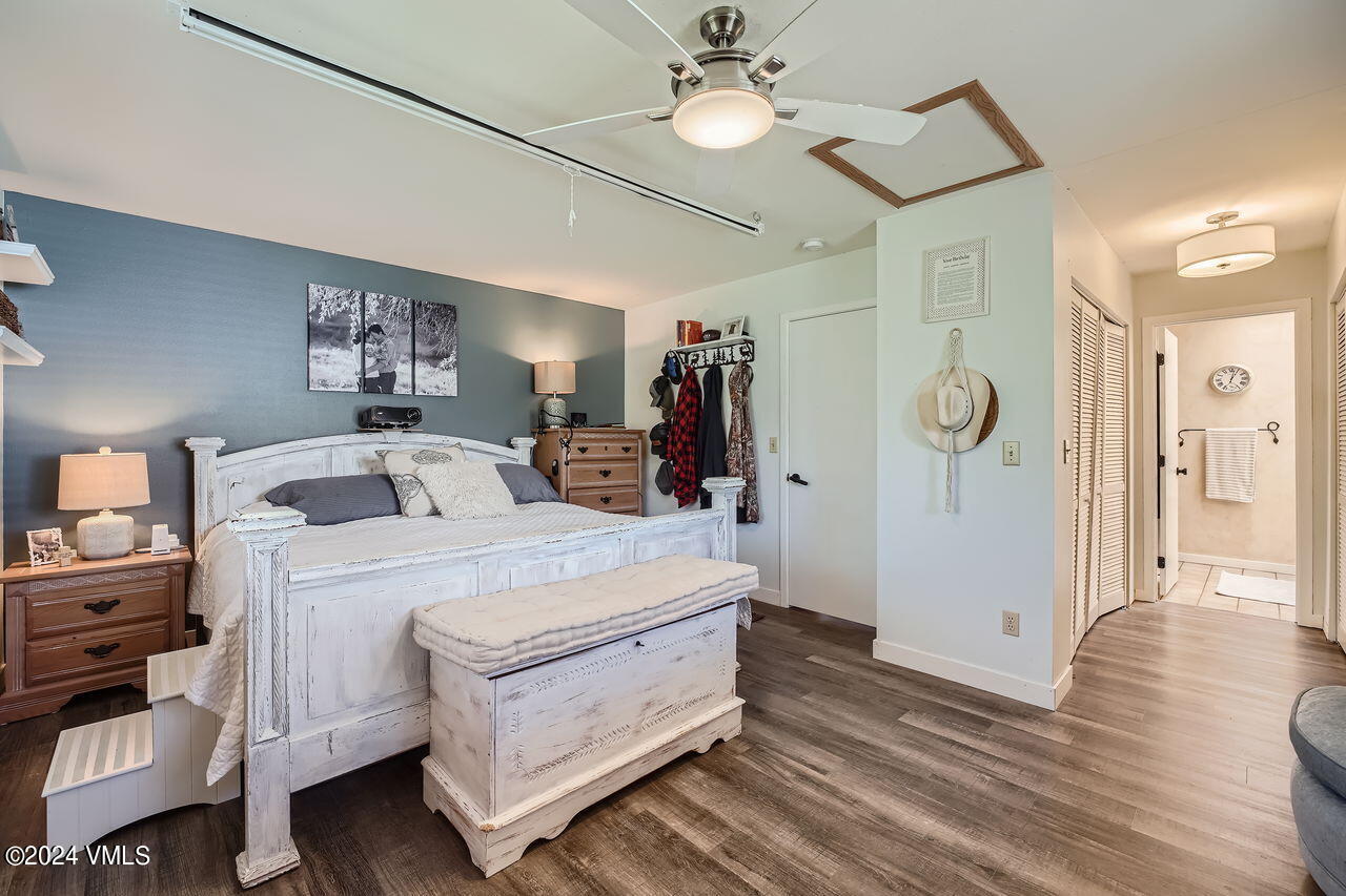 316 Golden Eagle Eagle, CO 81631 - Photo 16 of 25 a bed room with a bed and a chandelier