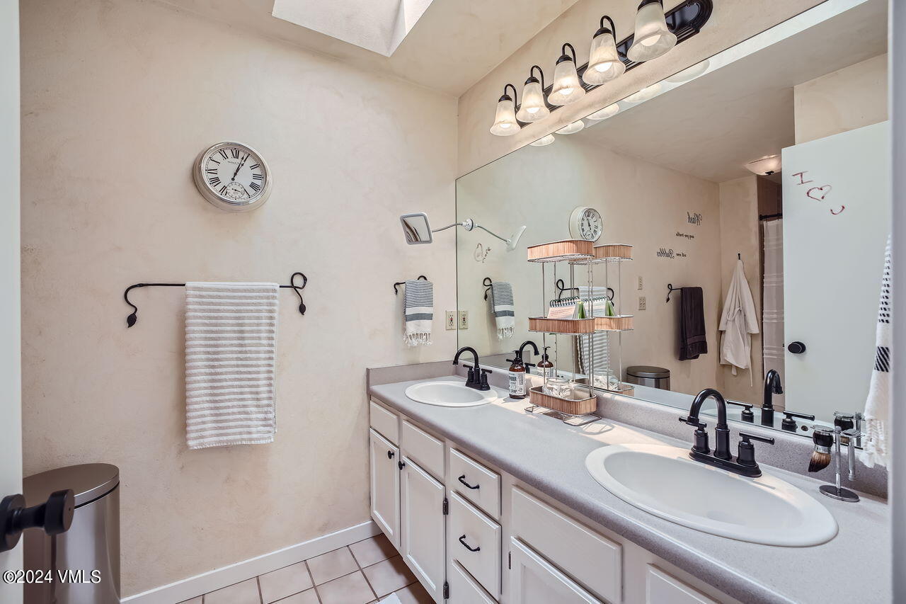 316 Golden Eagle Eagle, CO 81631 - Photo 17 of 25 a bathroom with a sink double vanity and a mirror