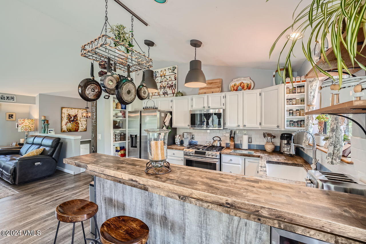316 Golden Eagle Eagle, CO 81631 - Photo 2 of 25 a view of a kitchen with granite countertop a sink and a stove