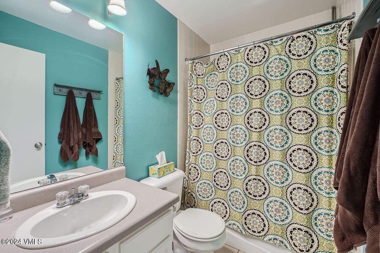 316 Golden Eagle Eagle, CO 81631 - Photo 21 of 25 a bathroom with a toilet sink shower and mirror