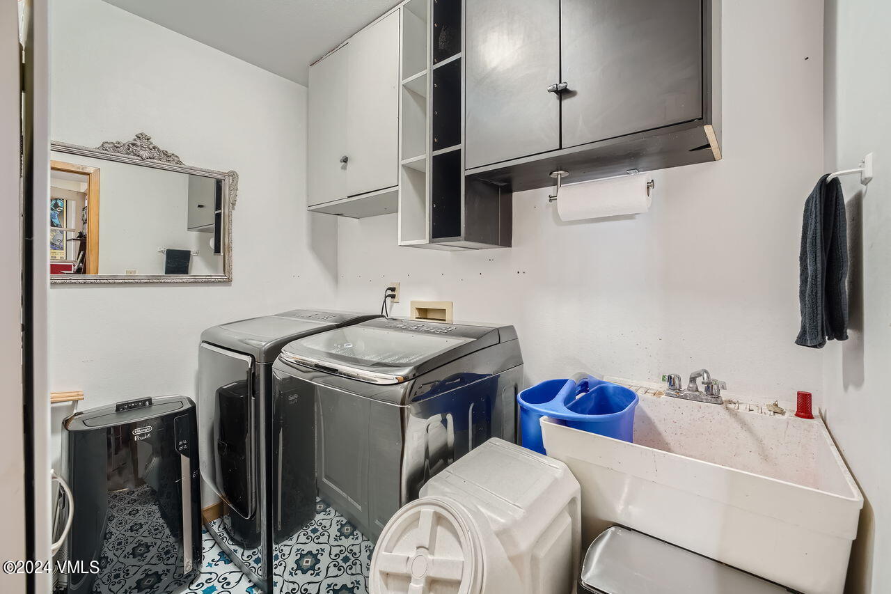 316 Golden Eagle Eagle, CO 81631 - Photo 22 of 25 a utility room with sink dryer and washer