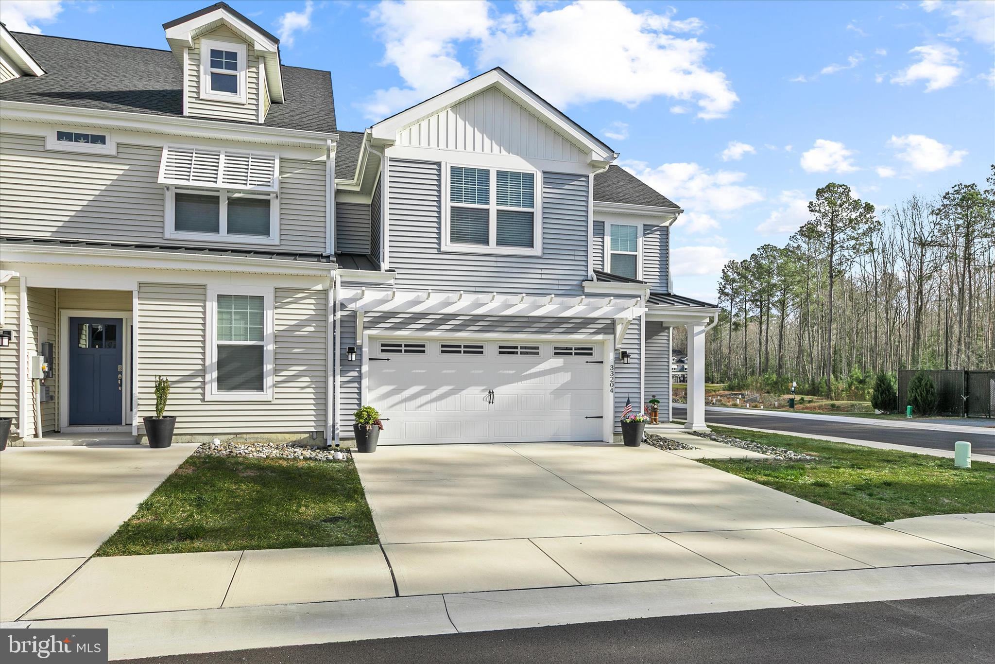33204 Cross Road Frankford, DE 19945 - Photo 1 of 35 a front view of a house with a yard